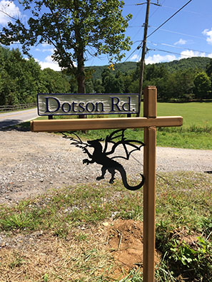 Plasma-cut steel dragon sign post decoration